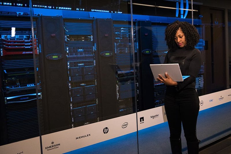 Microkernel - woman working at computer server room