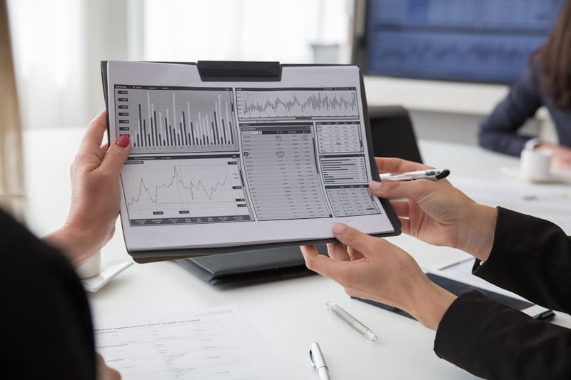 Ipo - business professionals analyzing financial charts