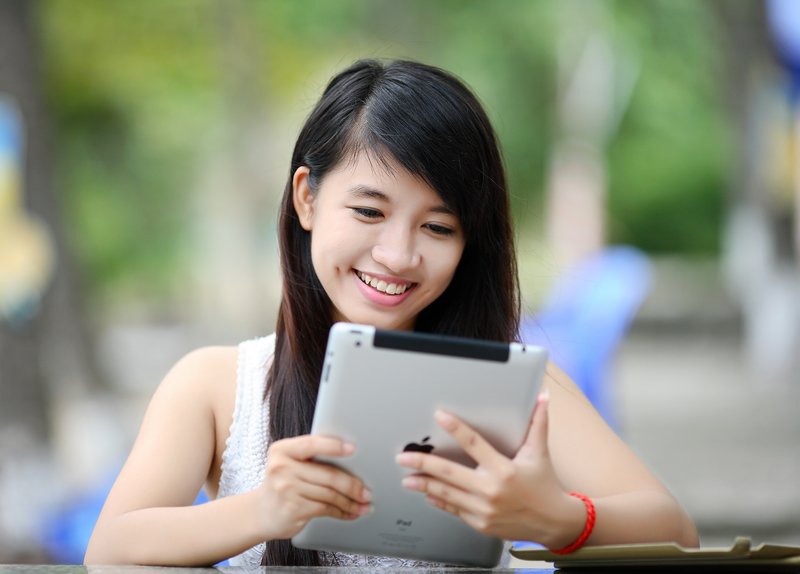 Children - family looking at tablet together