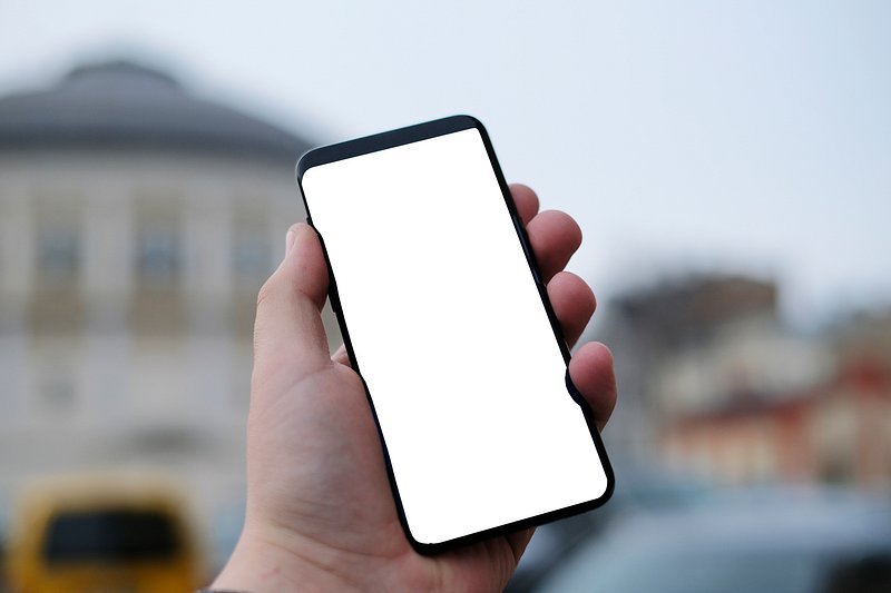Technological change - hands holding digital device with nature background