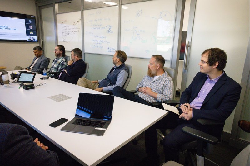 Order - stressed data scientists at computer workstations