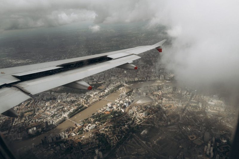 Climate - aircraft contrails over urban landscape